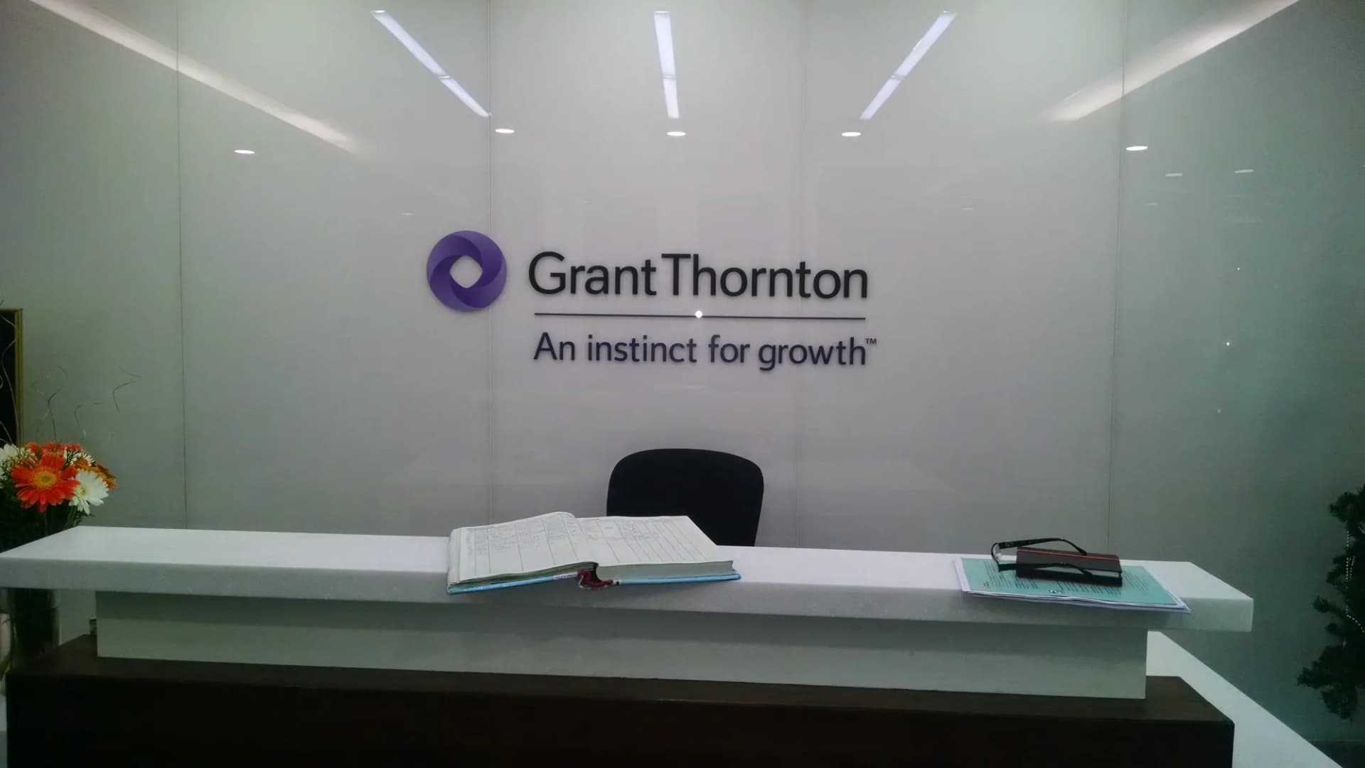 Grant Thornton logo and the line An instinct for growth on a white reception wall