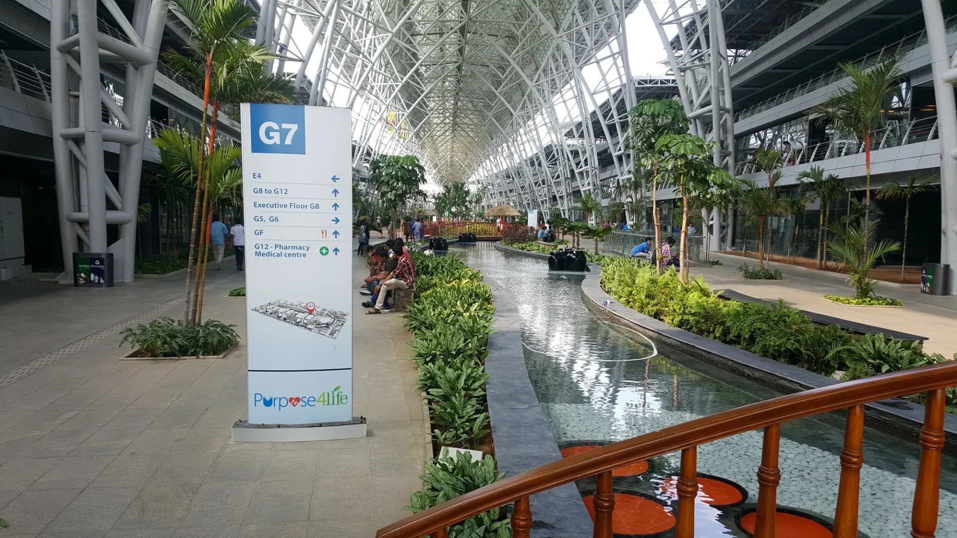 Block G7 directory totem beside the water channel in the International Tech Park Bangalore atrium