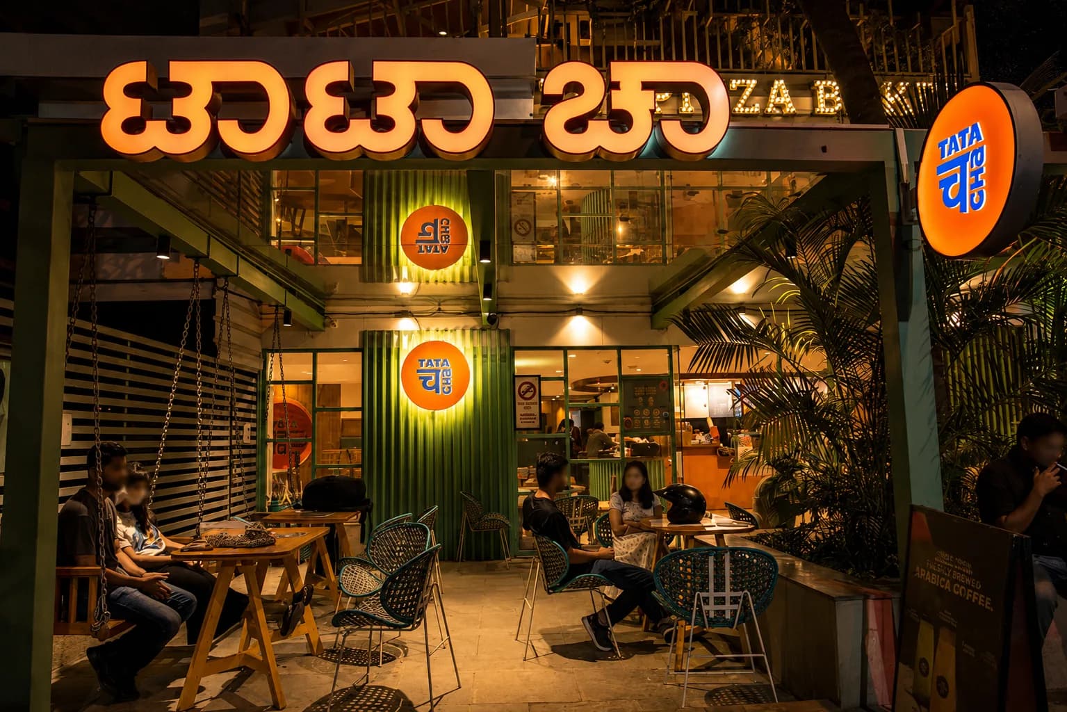 Tata Cha cafe front lit at night