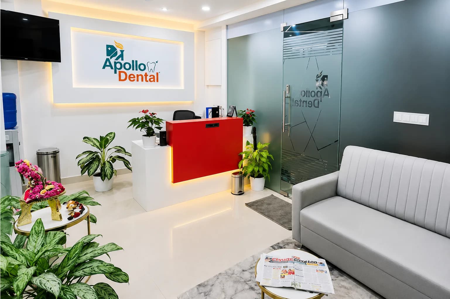 Apollo Dental reception with the logo on a backlit wall