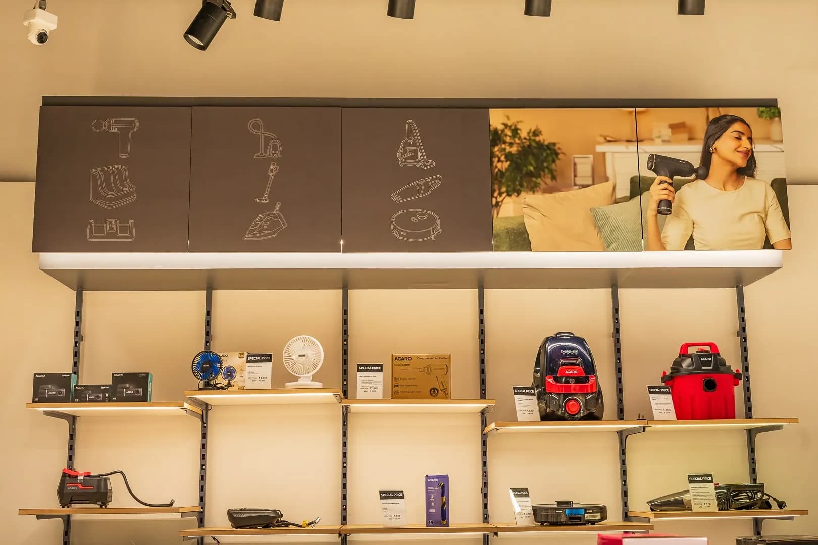 Agaro in-store wall bay: icon panels and a lifestyle photo above the shelves
