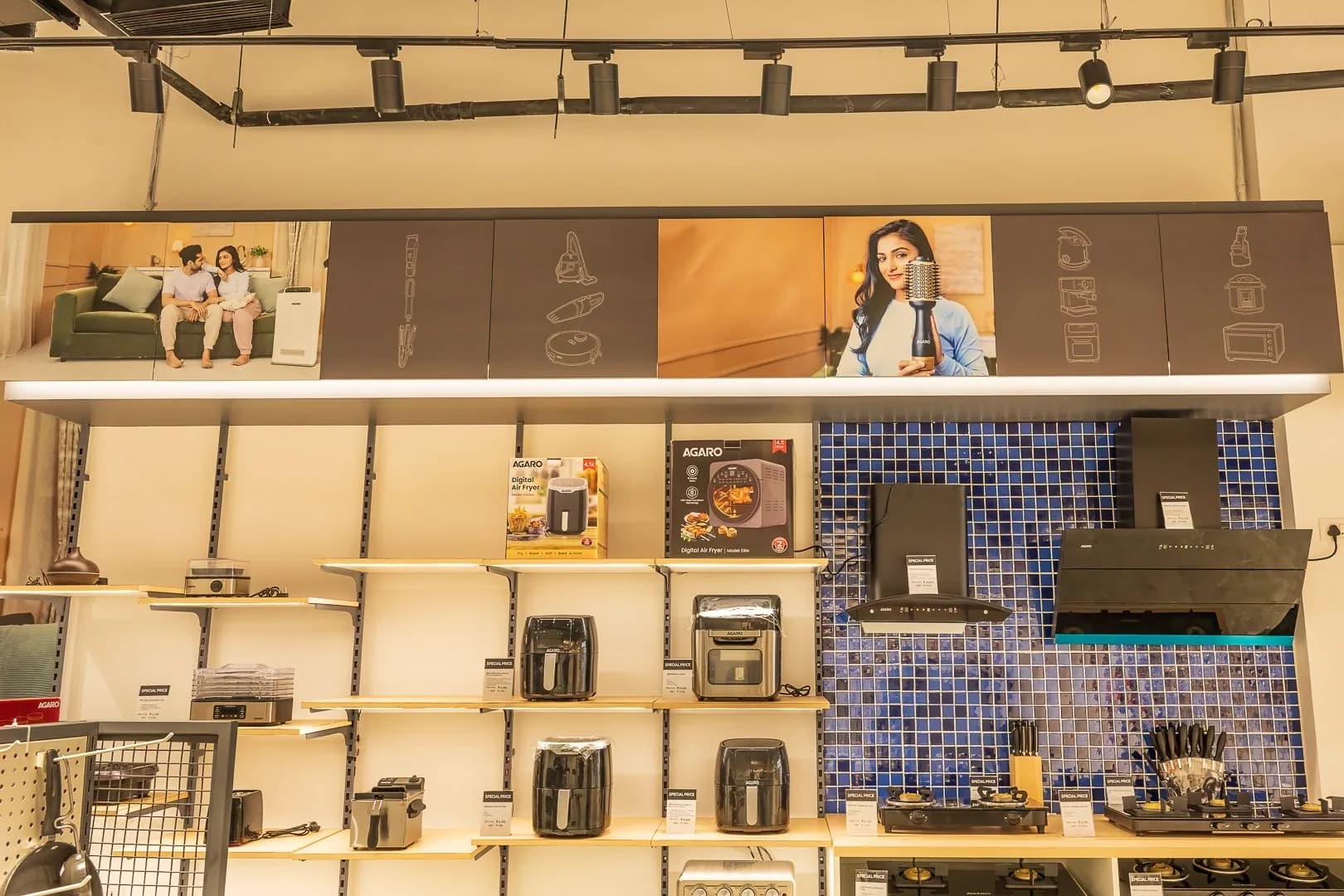 Agaro in-store wall: lifestyle photo headers and icon panels above the product shelves