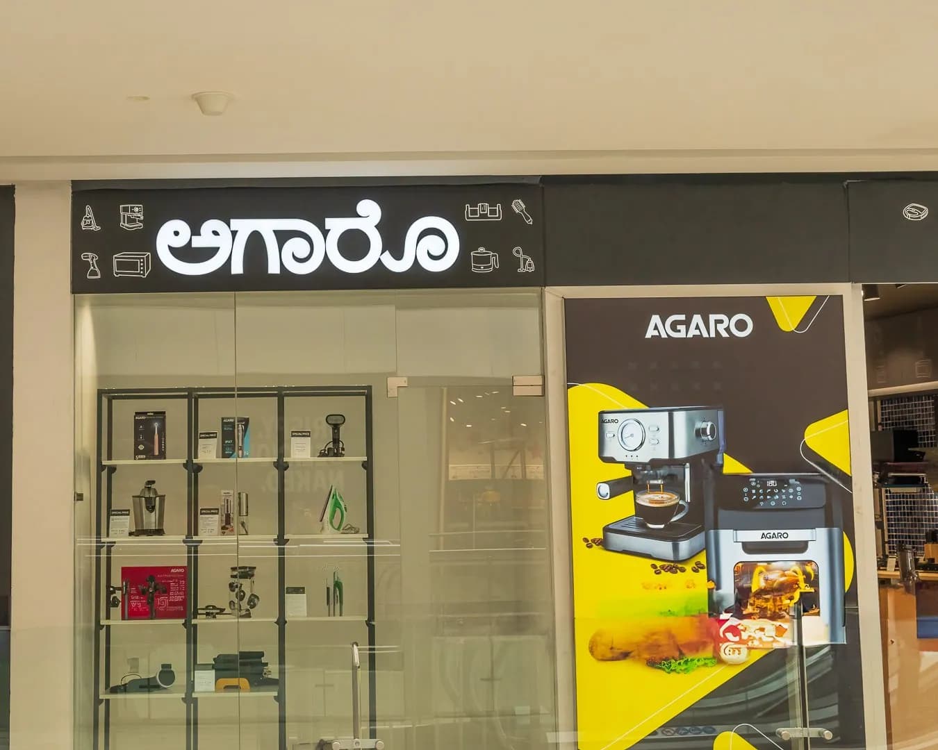 Agaro shopfront with the fascia in Kannada and English above the glazing
