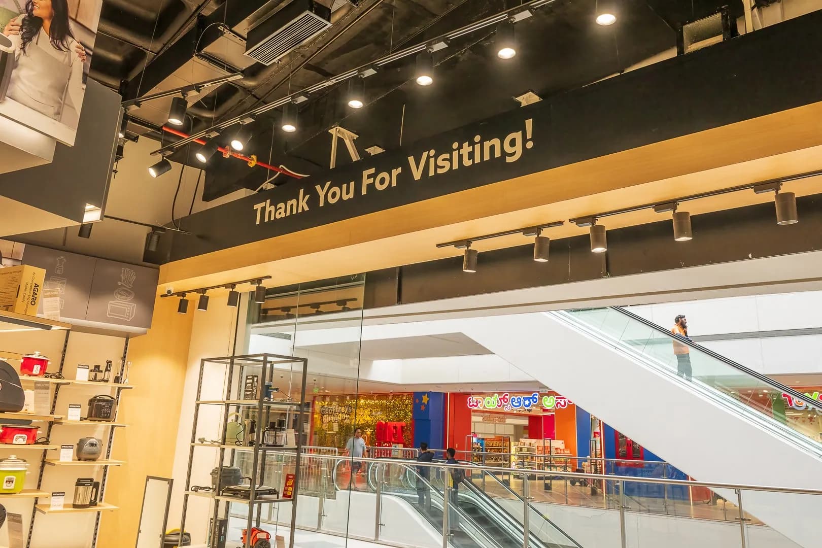 Thank you for visiting lettering on the soffit at the Agaro store exit