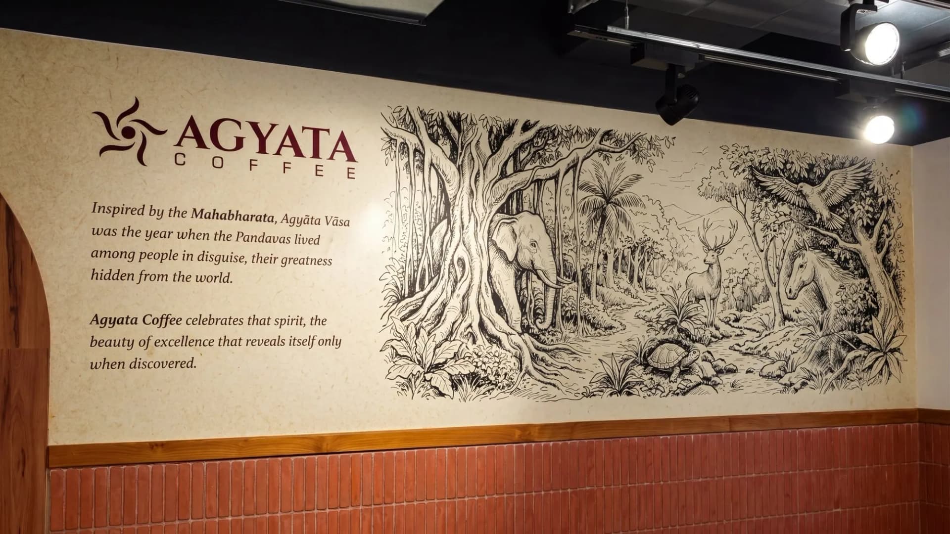 Agyata Coffee wall mural: the logo, the brand story and a pen-drawn banyan forest with animals