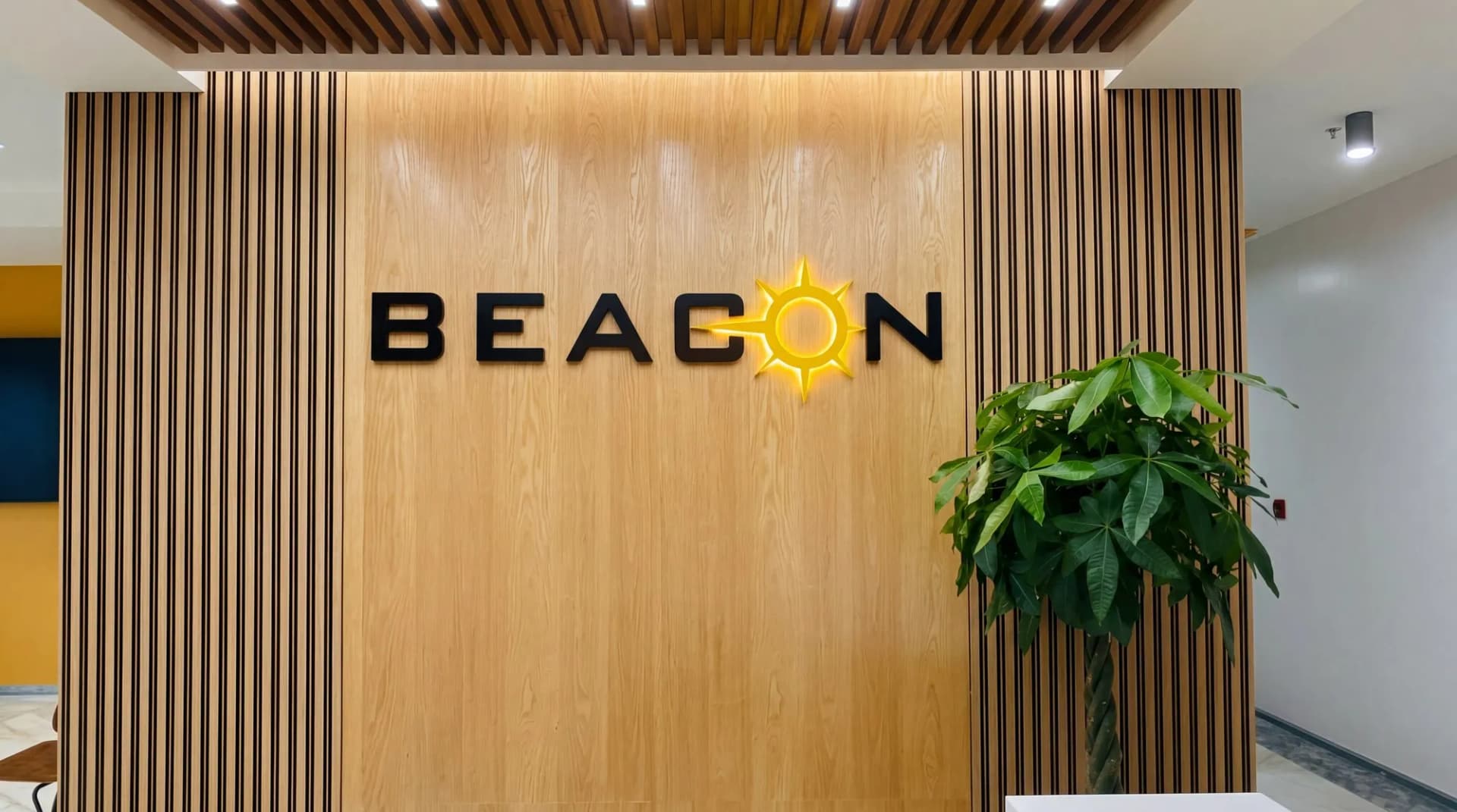 Beacon reception wall in oak veneer: black letters with a backlit yellow sun as the O