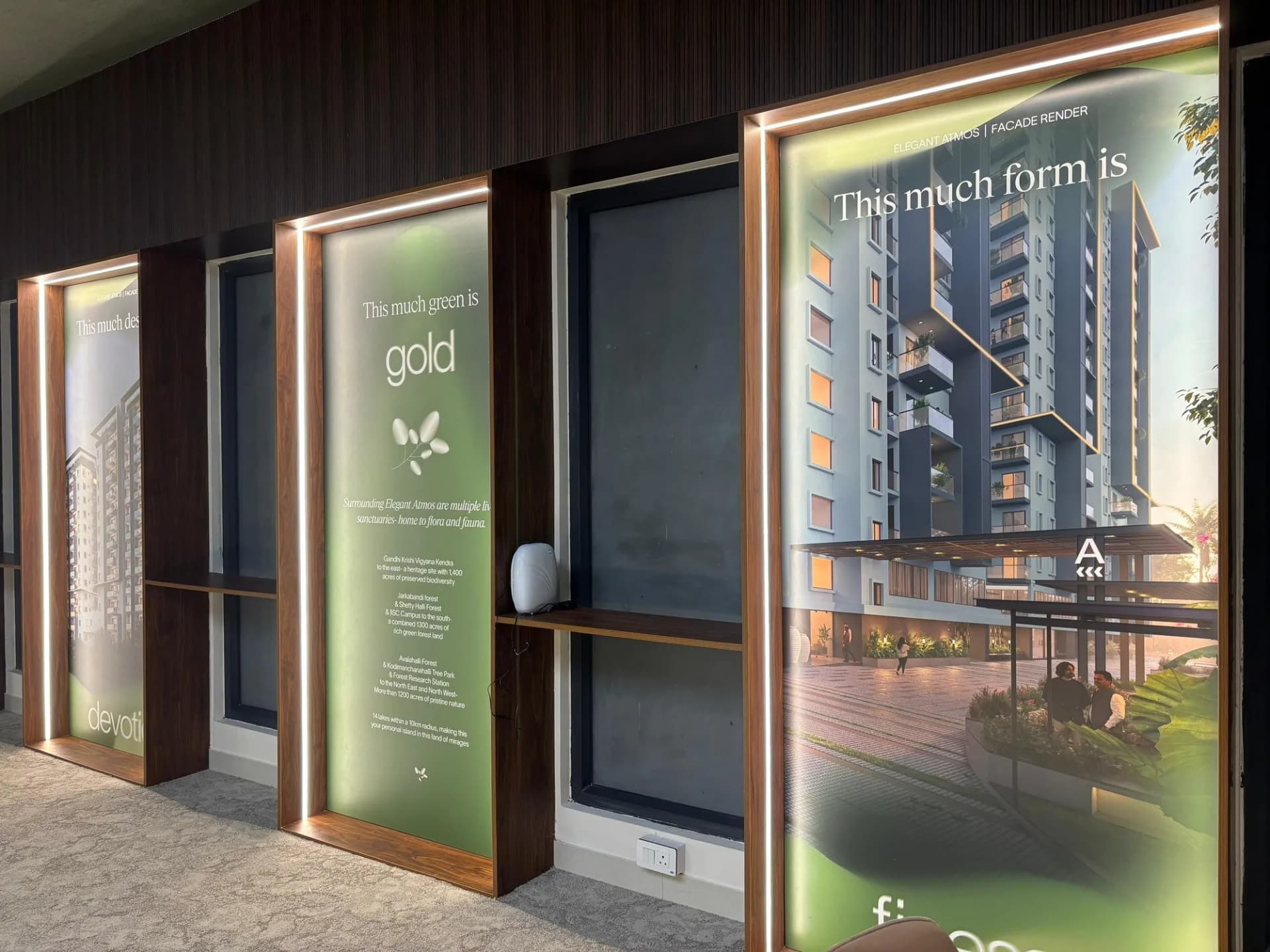 Backlit lightbox frames in walnut surrounds at the Elegant Atmos experience centre