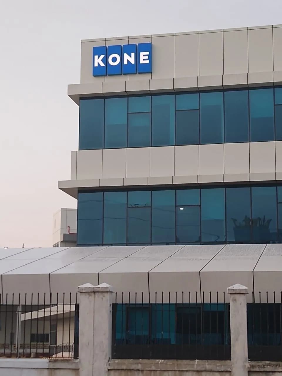 KONE logo box on top of a glass office block