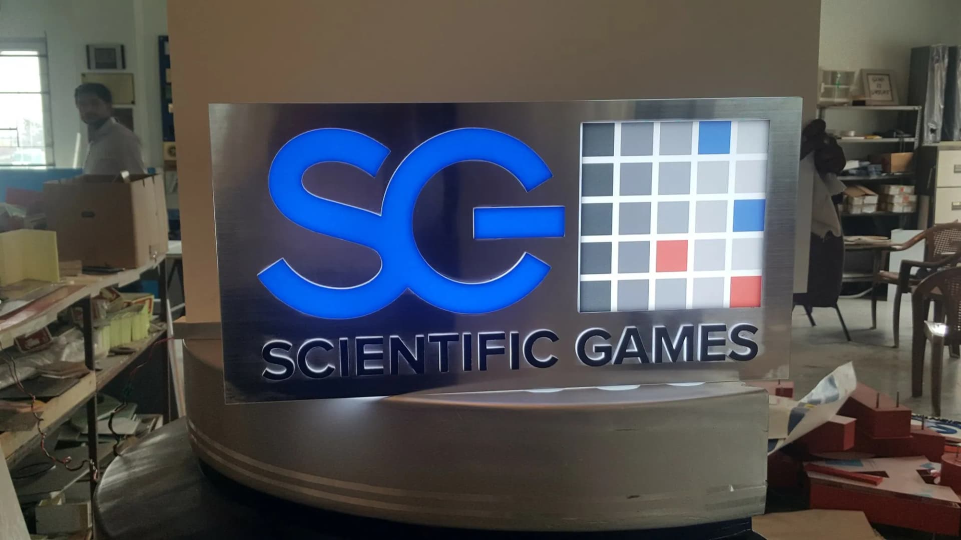 Scientific Games illuminated logo sign, photographed in the workshop before dispatch
