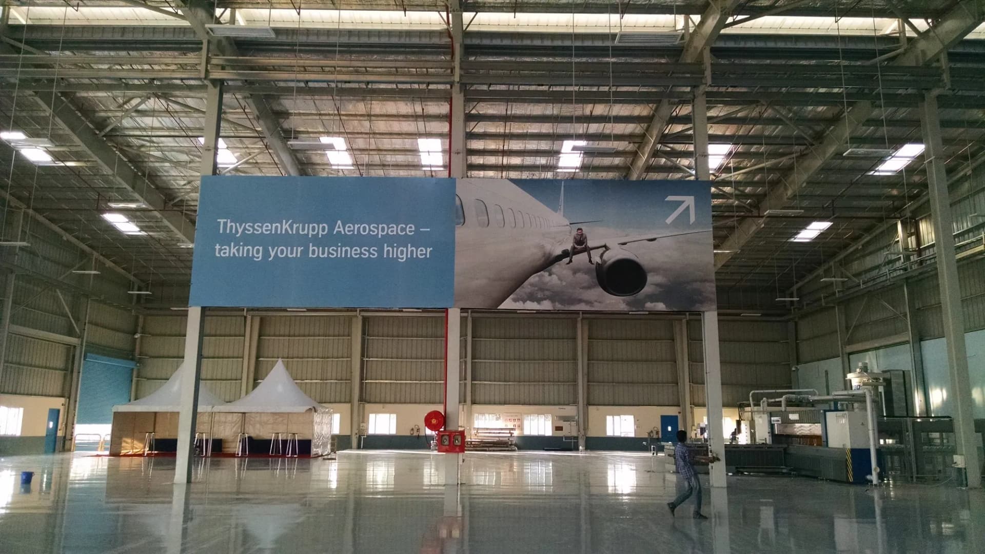 ThyssenKrupp Aerospace banner hung inside a hangar