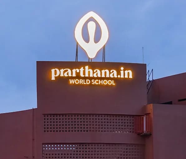 Liber Restobar illuminated entrance sign with a dimensional macaw and letters