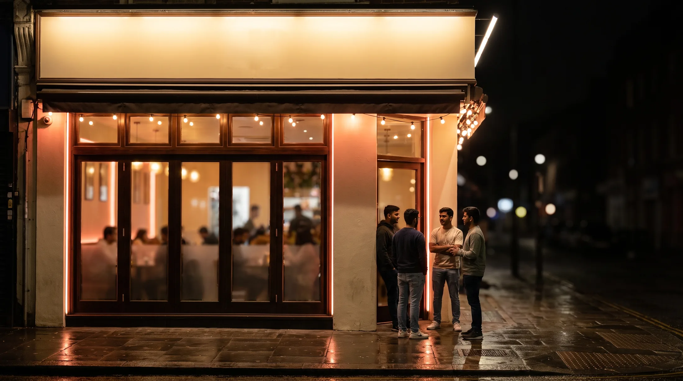 A restaurant or cafe with its identity and lighting switched on