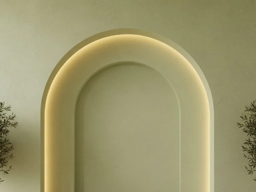 Sage plaster arch with warm light concealed along its edge